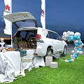 HUAWEI Photo Check In Spot With White SUV Open Trunk Balloons Table Chairs And Flags