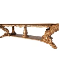 Luxurious Golden Dining Table With Ornate Carved Legs And Intricate Details