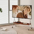 TV on Rolling Wooden Stand in Living Room With Potted Plant and Window Blinds