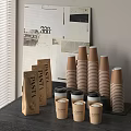 Stacked Brown Disposable Cups And Coffee Cups With Lids And Paper Bags