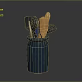 Blue Ceramic Jar With Various Kitchen Utensils Including Black And Wooden Tools
