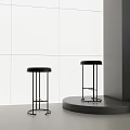Black Bar Stools With Round Seats And Metal Frames In Modern Minimalist Style