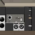Modern Laundry Space Featuring White Washing Machines Black Cabinets And Marble Backsplash