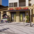 Vibrant Commercial Street with Multi Story Buildings Various Shops Pedestrians And Paved Plaza Area