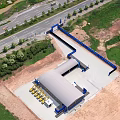 Aerial View Of Construction Site With Building Structure Construction Equipment Road And Green Trees