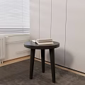 Dark Round Top Side Table With Three Legs And Books In Indoor Window Blinds Setting 3d model