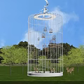 White Birdcage Art Installation Placed On Green Grass Field With Small Trees