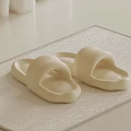 Soft Comfortable Cream Slippers On Beige Woven Home Floor Mat