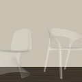 Transparent Curved Leisure Chairs in Light Wall and Wooden Floor Interior