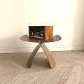 Wooden Side Table with Unique Triangular Legs and Vintage Radio on Top in Modern Room