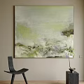 Soft Green And Gray Abstract Painting On Beige Wall With Black Chair And Potted Plant