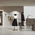 Fashion Clothing Store Interior With Clothing Racks Mannequin And Displayed Apparel