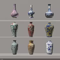 Various Traditional Ceramic Vases With Colorful Patterns Displayed On Shelves