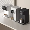Stylish Kitchen Appliances With Three Modern Coffee Makers In White Light Gray And Black