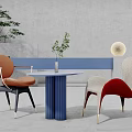 Modern Table And Chair Set With Blue Column Base And Colorful Upholstered Chairs