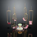 Play Equipment With Pink And Gold Hanging Swings And Central Colorful Rotating Device