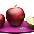 Red Apples and Cut Green Apple on Purple Plate with Yellow Background and Del Monte Label