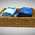 Wicker Home Organization Basket With Neatly Folded Shirts Jeans And Clothes