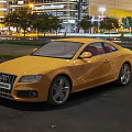 Sleek Yellow Audi Coupe Parked In Urban Night Scene With Street Lights And Trees