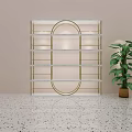 Modern Display Shelf With Golden Frame Against Green Wall And Potted Plant On Terrazzo Floor
