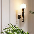 Elegant Black Wall Lamp with Gold Accent and Warm Light in Living Room Decor