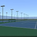 Outdoor Tennis Courts With Green And Blue Surface And Surrounding Fences Light Poles
