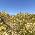 Scenic Mountain Landscape With Green Vegetation And Winding Paths Under Blue Sky