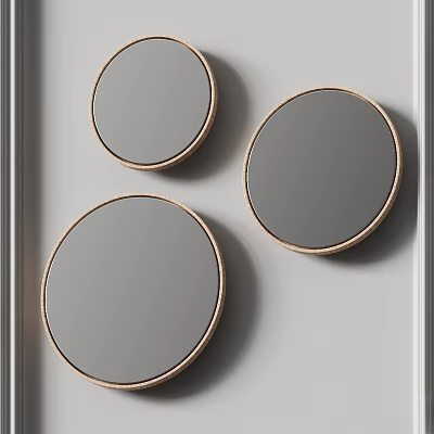 Three Stylish Modern Round Gold Framed Mirrors Hanging On White Wall 3d model