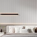 Modern Minimalist Bedroom With Striped Wall Long Pendant Light Nightstand Vase Books And Decorative Pillows
