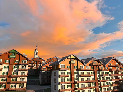 Residential Building Complex With Red Brick White Walls Featuring Spire Under Orange Sunset Sky Clouds 3d model