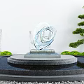 Garden Ornament With Transparent Glass Sculpture Circular Stone Platform Fountains And Green Plants