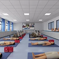 Medical Training Laboratory With Mannequins on Mats Red Boxes Large Screen and Cabinets