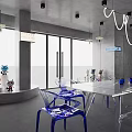 Modern Interior Space Featuring Transparent Chairs Blue Bases White Table Collectible Figures And Pendant Lights