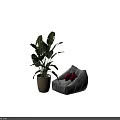 Gray Bean Bag Chair with Red Cushions and Large Green Plant in Woven Basket