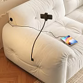 Living Room White Sofa With Black Phone Holder Tablet And Digital Accessories