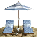 Blue Wicker Lounge Chairs With Striped Pillows Under Beach Umbrella On Sand