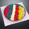 Colorful Fresh Mixed Fruits Plate with Raspberries Blueberries Banana and Kiwi Slices on White Napkin