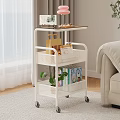 Warm Living Room With White Rolling Cart Tablet Desserts Pink Lamp Books And Green Plant