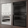 Modern Kitchen Built In Oven And Microwave Appliances In Wooden Cabinets