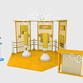 Interactive Zone With Yellow Fencing Punching Bags And Blue Signage
