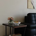 Sleek Modern Glass Top Side Table Beside Black Leather Sofa For Stylish Living Room Decor