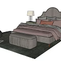 Modern Double Bed With Arched Headboard Multiple Pillows Nightstands Table Lamps Knitted Ottoman And Cozy Rug