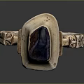 Metallic Ring With Dark Blue Gemstone And Carved Side Details For Daily Use