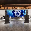 Traditional Cultural Exhibition Hall Featuring Circular Ceiling Pattern And Illuminated Display Stands