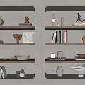 Decorative Ornament Arrangement On Illuminated Niche Shelves Featuring Vases Sculptures Books And Bowls
