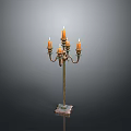 Vintage Brass Candelabra With Five Lit Candles And Decorative Base