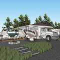 Scenic Camping Campsite With RVs Tents Fire Pit And Pine Trees At Twilight