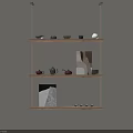 Wall Mounted Wooden Shelves On Neutral Beige Wall With Teapots Cups And Decorative Artworks