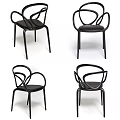 Modern Black Leisure Chair With Curved Metal Frame And Side Table Decor