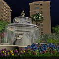 Illuminated Water Fountain In Night Garden With Tulips Trees And High Rise Buildings
